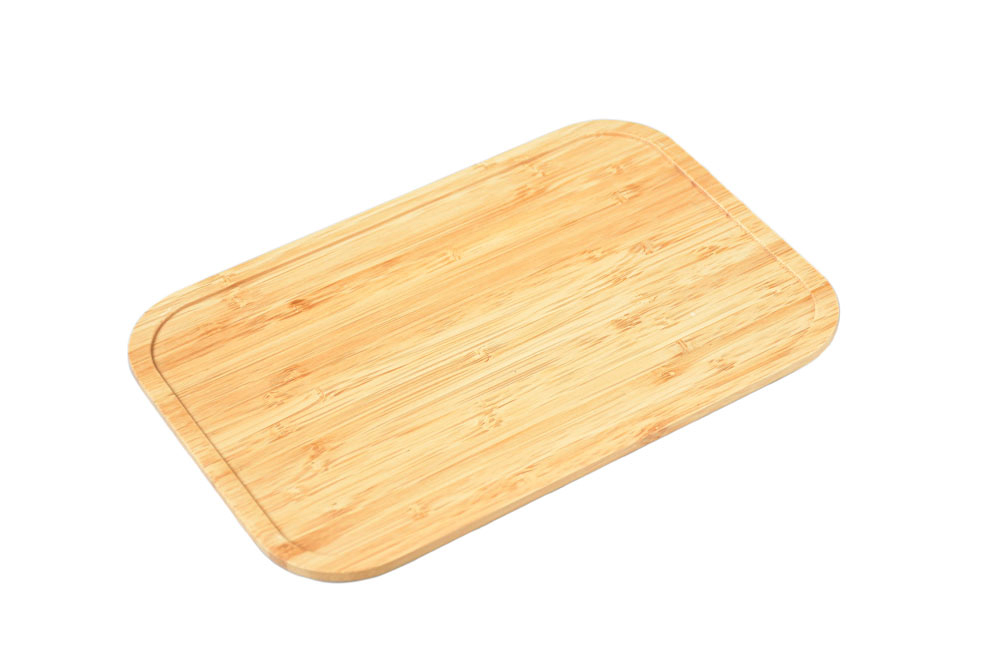 Angled view of bamboo lid for lunch box – rectangular replacement lid made of light bamboo wood on a white background