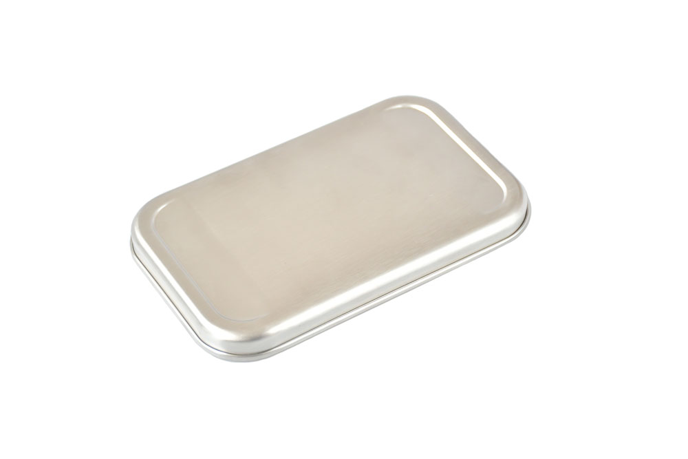 Angled view Stainless steel lid for lunch box – shiny replacement lid made of stainless steel on a white background